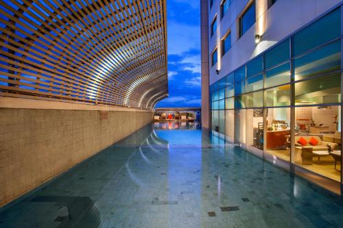 Swimming pool, HARRIS Hotel & Conventions Festival CityLink in Bandung Swimming pool, HARRIS Hotel & Conventions Festival CityLink in Bandung