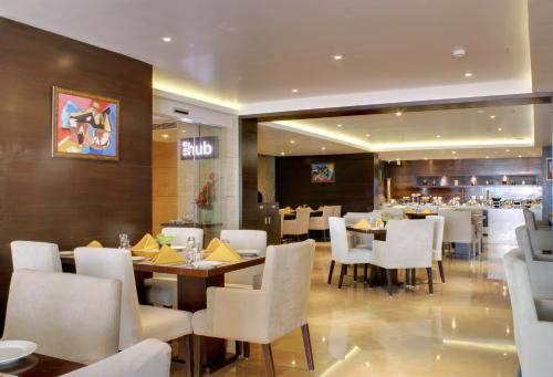Restaurant, Ramada Encore by Wyndham Bangalore Domlur in Marathahalli Restaurant, Ramada Encore by Wyndham Bangalore Domlur in Marathahalli