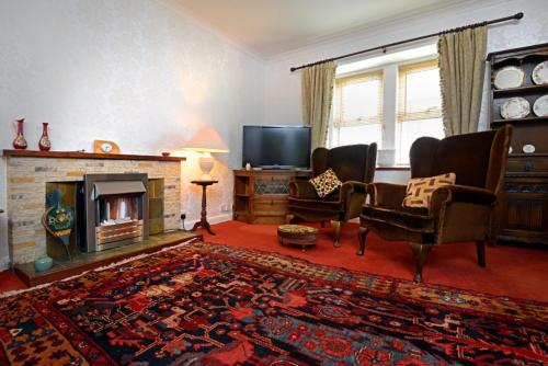 Shared lounge/TV area, Granny’s Cottage in Newcastleton Shared lounge/TV area, Granny’s Cottage in Newcastleton
