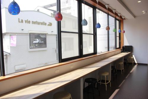 gedeelde lounge/tv-ruimte, MEZAME HOSTEL near Nagasaki Peace Park gedeelde lounge/tv-ruimte, MEZAME HOSTEL near Nagasaki Peace Park