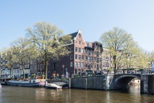 This photo about Jordaan apartments - Noordermarkt area shared on HyHotel.com