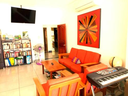 Shared lounge/TV area, Jomtien Hostel near Jomtien Beach Shared lounge/TV area, Jomtien Hostel near Jomtien Beach