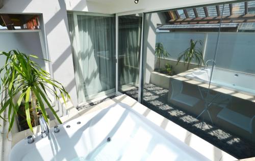 Balcony/terrace, HARRIS Hotel & Residences Sunset Road in Kuta Balcony/terrace, HARRIS Hotel & Residences Sunset Road in Kuta