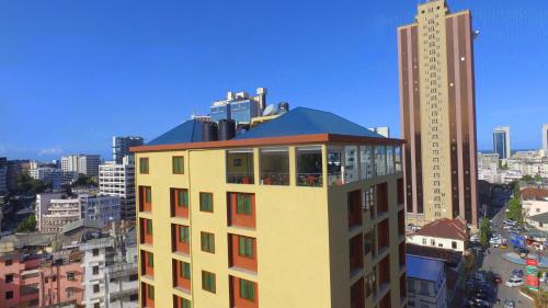 Зовнішній вигляд готелю, Tiffany Diamond Hotels - Makunganya Street in Дар-ес-Салам Зовнішній вигляд готелю, Tiffany Diamond Hotels - Makunganya Street in Дар-ес-Салам
