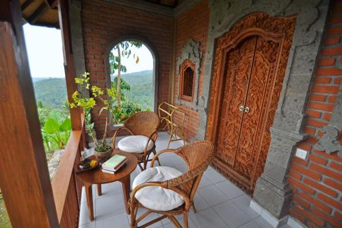 Balcony/terrace, Puri Lumbung Cottages, Restaurant & Spa, Munduk in Munduk Balcony/terrace, Puri Lumbung Cottages, Restaurant & Spa, Munduk in Munduk