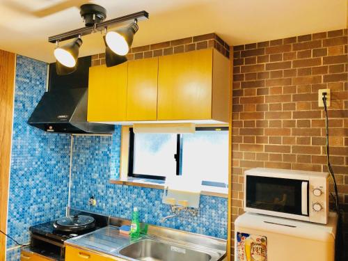 Kitchen, Midtown Sakura Apartment House 101 予約者だけの空間 A space just for you in Nachikatsuura Kitchen, Midtown Sakura Apartment House 101 予約者だけの空間 A space just for you in Nachikatsuura