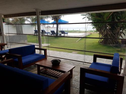Shared lounge/TV area, Tropical Beach House, Hikkaduwa in Hikkaduwa Shared lounge/TV area, Tropical Beach House, Hikkaduwa in Hikkaduwa