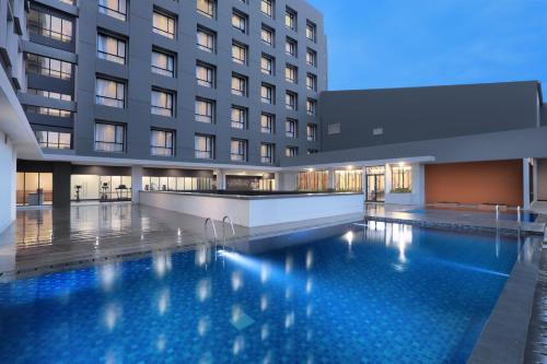 Swimming pool, Harper Palembang by ASTON in Palembang Swimming pool, Harper Palembang by ASTON in Palembang