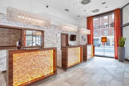Vestíbulo, H4 Hotel Munster in Munster City Center Vestíbulo, H4 Hotel Munster in Munster City Center