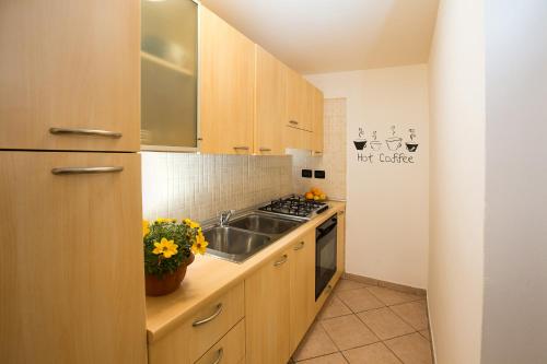 Kitchen, Sant’Orsola Apartment in East Bologna Kitchen, Sant’Orsola Apartment in East Bologna