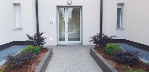 Ingresso, CaseOspitali - CASA AZZURRA incantevole bilocale con giardino in Cernusco Sul Naviglio Ingresso, CaseOspitali - CASA AZZURRA incantevole bilocale con giardino in Cernusco Sul Naviglio