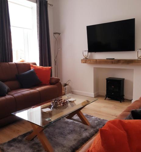 Shared lounge/TV area, The Coal House in Townhill Shared lounge/TV area, The Coal House in Townhill