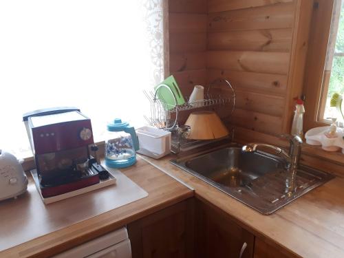 Kitchen, Коттедж в Финляндии (Тохмаярви) in Tohmajarvi Kitchen, Коттедж в Финляндии (Тохмаярви) in Tohmajarvi