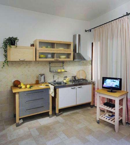 Kitchen, Abbaechelu in Santa Margherita di Pula Kitchen, Abbaechelu in Santa Margherita di Pula