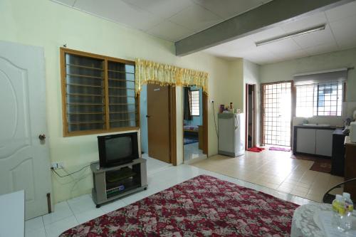 Shared lounge/TV area, Singgahan Keluarga Jitu near Politeknik Sultan Abdul Halim Muadzam Shah Shared lounge/TV area, Singgahan Keluarga Jitu near Politeknik Sultan Abdul Halim Muadzam Shah