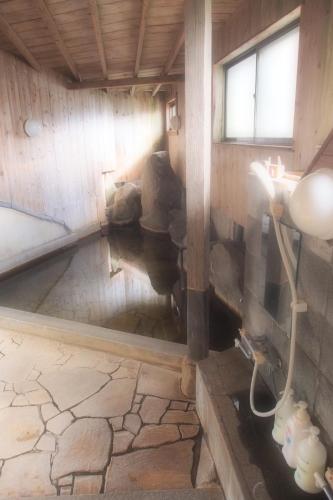 Hot spring bath, Yufuin Country Road Youth Hostel in Yufu Hot spring bath, Yufuin Country Road Youth Hostel in Yufu