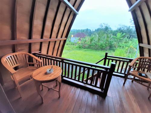 balkon/terras, Telagamas Guest House in Gianyar balkon/terras, Telagamas Guest House in Gianyar