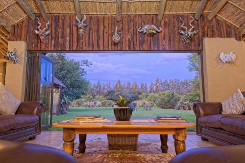 Shared lounge/TV area, Chrislin African Lodge in Addo Shared lounge/TV area, Chrislin African Lodge in Addo