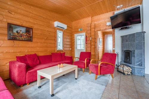 Shared lounge/TV area, Lomaperkkio Apartments in Sotkamo Shared lounge/TV area, Lomaperkkio Apartments in Sotkamo