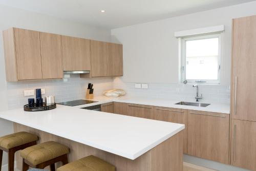 Kitchen, Blue Lace Condo Suite Grenada in Lower Woburn Kitchen, Blue Lace Condo Suite Grenada in Lower Woburn