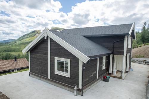 Widok z zewnątrz, Rolfhytta - Fosskamben 19 in Sogndal Widok z zewnątrz, Rolfhytta - Fosskamben 19 in Sogndal