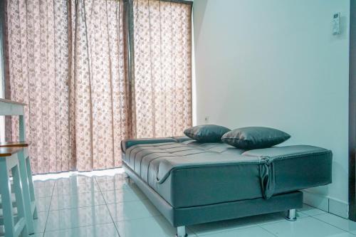 Fully Furnished and Homey 1BR Casa De Parco Apartment By Travelio