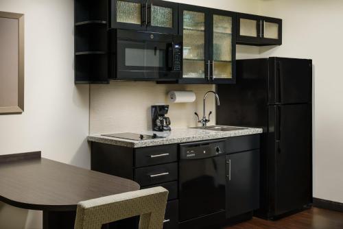 Kitchen, Candlewood Suites Orlando - Lake Buena Vista By IHG in South West Kitchen, Candlewood Suites Orlando - Lake Buena Vista By IHG in South West