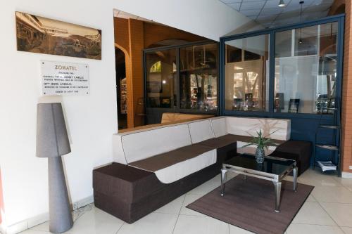 Общ салон/телевизионна зона, Zomatel Hotel in Fianarantsoa Общ салон/телевизионна зона, Zomatel Hotel in Fianarantsoa