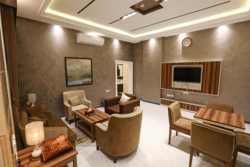 Общ салон/телевизионна зона, Qasr Alhanen Furnished Apartments in Al Aziziyah Общ салон/телевизионна зона, Qasr Alhanen Furnished Apartments in Al Aziziyah