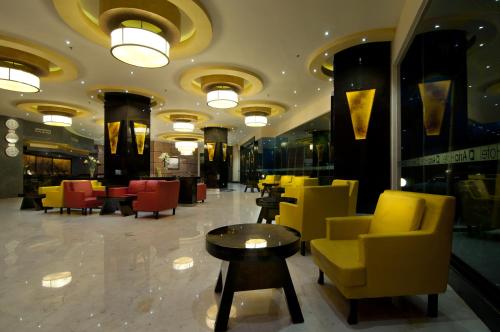 Shared lounge/TV area, Aria Gajayana Hotel in Malang Shared lounge/TV area, Aria Gajayana Hotel in Malang