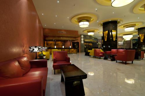 Shared lounge/TV area, Aria Gajayana Hotel in Malang Shared lounge/TV area, Aria Gajayana Hotel in Malang