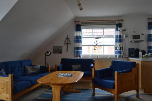 Zajednički dnevni boravak / prostorija s TV-om, Haus Schimmelreiter in Krummhorn Zajednički dnevni boravak / prostorija s TV-om, Haus Schimmelreiter in Krummhorn
