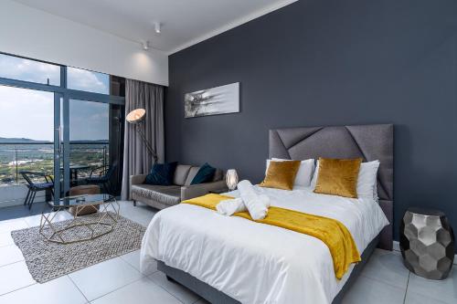 Bed, Top Floor Menlyn Maine studio apartment with Stunning Views & No Load Shedding in Pretoria Bed, Top Floor Menlyn Maine studio apartment with Stunning Views & No Load Shedding in Pretoria