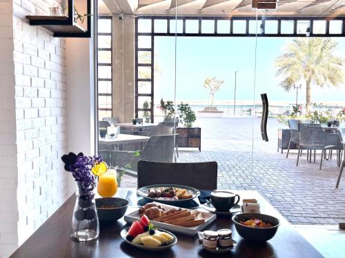 Restaurante, JANNAH HOTEL APARTMENTS & VILLAS in Ras Al Khaimah Restaurante, JANNAH HOTEL APARTMENTS & VILLAS in Ras Al Khaimah