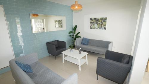 Shared lounge/TV area, The Pelican Poshtel in San Juan Shared lounge/TV area, The Pelican Poshtel in San Juan