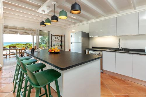кухня, Villa du Cap 5 étoiles piscine et vue mer exceptionnelle (Villa du Cap 5 etoiles piscine et vue mer exceptionnelle) in Mare Gaillard кухня, Villa du Cap 5 étoiles piscine et vue mer exceptionnelle (Villa du Cap 5 etoiles piscine et vue mer exceptionnelle) in Mare Gaillard