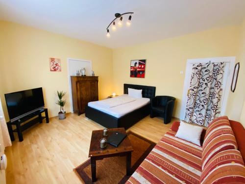 Gostinjska soba, Single-Apartment bis 2 Personen, 27qm in Schleusingen, WLAN, Parkplatz in Sankt Kilian Gostinjska soba, Single-Apartment bis 2 Personen, 27qm in Schleusingen, WLAN, Parkplatz in Sankt Kilian