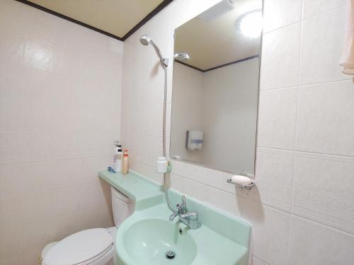 חדר אמבטיה, Bomulseom Pension near Seongsan Ilchulbong Peak חדר אמבטיה, Bomulseom Pension near Seongsan Ilchulbong Peak