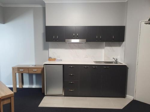 Kitchen, Madison Capital Executive Apartment Hotel in Canberra Kitchen, Madison Capital Executive Apartment Hotel in Canberra