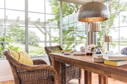 zonă comună salon/TV, Faehrhauslodges, Natur in Sicht in Norden zonă comună salon/TV, Faehrhauslodges, Natur in Sicht in Norden