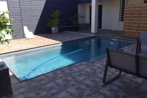 Kolam renang, Ylang Résidence avec piscine chauffée & jacuzzi (Ylang Residence avec piscine chauffee & jacuzzi) in Saint Andre Kolam renang, Ylang Résidence avec piscine chauffée & jacuzzi (Ylang Residence avec piscine chauffee & jacuzzi) in Saint Andre
