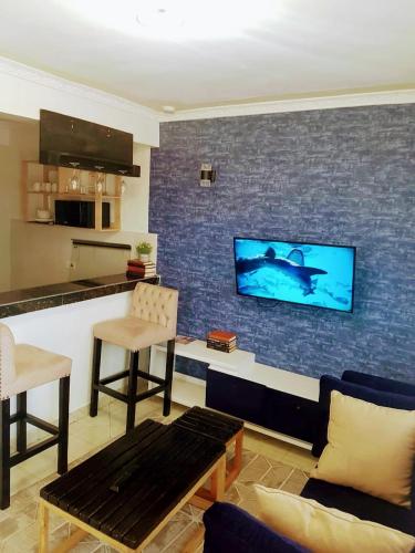 Bar, Sandalwood Suites - Serviced One Bedroom Holiday Homes in Nakuru Bar, Sandalwood Suites - Serviced One Bedroom Holiday Homes in Nakuru
