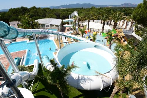 Swimming pool, Camping Resort La Baume La Palmeraie in Capitou Swimming pool, Camping Resort La Baume La Palmeraie in Capitou