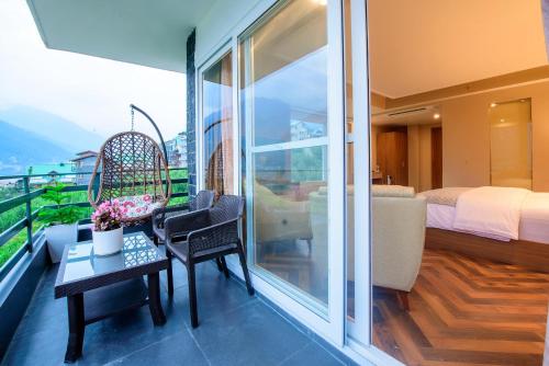 Balcony/terrace, NatureVilas Sarovar Portico in Gadherni Balcony/terrace, NatureVilas Sarovar Portico in Gadherni