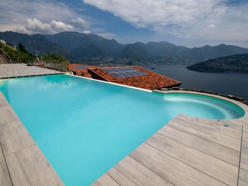 Vista/Panorama, Taormina with garden, swimming pool and lake view in Parzanica Vista/Panorama, Taormina with garden, swimming pool and lake view in Parzanica