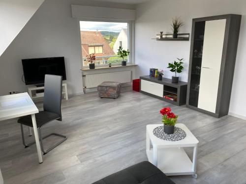 Shared lounge/TV area, Helle moderne Ferienwohnung, Nahe Koblenz am Rhein in Weitersburg Shared lounge/TV area, Helle moderne Ferienwohnung, Nahe Koblenz am Rhein in Weitersburg