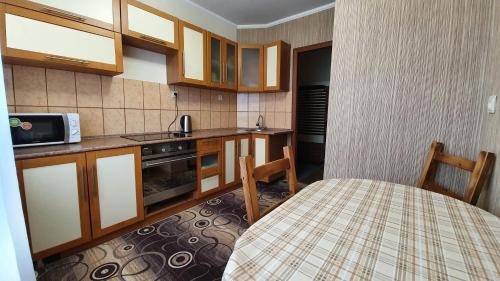 Kitchen, Просторные 2-к апартаменты in Kogalym Kitchen, Просторные 2-к апартаменты in Kogalym