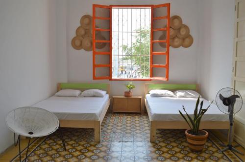 Bed, El Habitante Casa Cultural & Hostal in Ciénaga Bed, El Habitante Casa Cultural & Hostal in Ciénaga