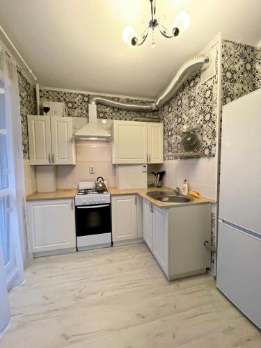Kitchen, Уютная 1-ком квартира in Kaliningrad Kitchen, Уютная 1-ком квартира in Kaliningrad