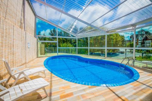 Swimming pool, Hotel Euro Suite Campos do Jordao By Nacional Inn - A 800 metros da Vila Capivari in Campos Do Jordao Swimming pool, Hotel Euro Suite Campos do Jordao By Nacional Inn - A 800 metros da Vila Capivari in Campos Do Jordao